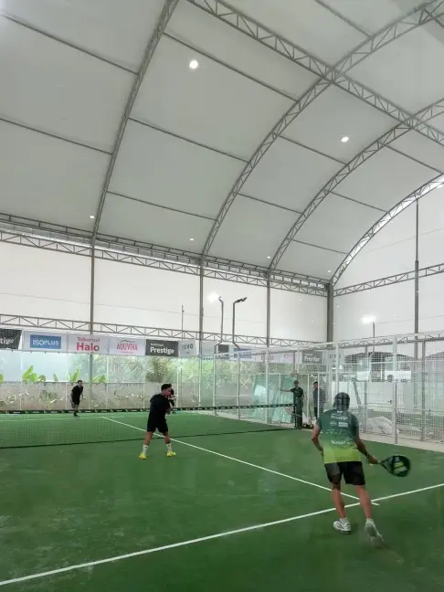 Players mid-rally under the canopy